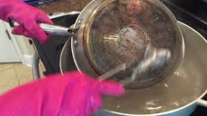Bring the pan to a boil on a stovetop flame. How To Remove Stubborn Grease And Stain Of The Bottom Of Stainless Pans Youtube