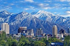 Custom Suits Utah Skyline Of Downtown Salt Lake City With The Towering Wasatch Mountain Range In The Salt Lake City Downtown Salt Lake City Utah Salt Lake City