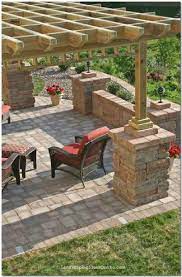 My Hubby Is About To Build A Pergola For Our Back Patio Love The Stones Around The Support Beams To Dress It Patio Stones Stone Patio Designs Backyard Patio