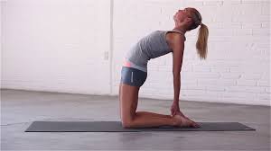 Before bending backwards into full camel pose, inhale and raise your right arm above your head. Yoga How To Do Camel Pose Youtube