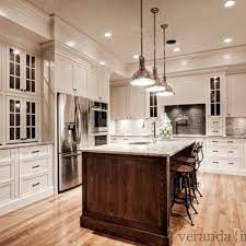Check out some lovely examples and learn how to select the perfect white paint for your space. Roman White Granite Countertops Transitional Kitchen Benjamin Moore White Dove Brown Kitchen Cabinets Kitchen Design Kitchen Remodel