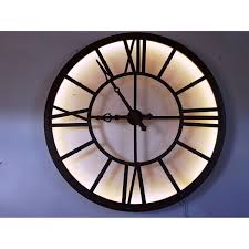 It is impressive and looks this unique large wall clock is made of wrought iron. London Large Wrought Iron Effect Urban Chic Illuminated Wall Clock Wall Clock Clock Wrought Iron