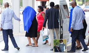 By a correspondent | former first lady grace mugabe has been sued over her late husband's corpse. Grace Mugabe Hides Under A Blanket Outside Funeral Home Singapore Daily Mail Online