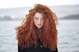 Woman With Curly Red Hair Red Curly Hair Curly Hair Styles Ginger Hair