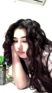 Indoor Scene with Curly-Haired Individual