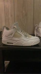 These sneakers showcase white upper leather bases with white mesh overlays. Air Jordan 4 Pure Money Kixify Marketplace