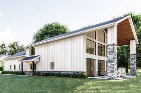 Looking over lake conjola on the nsw south coast is the modern barn style home david gleeson and leah atkins created in just 10 weeks. Plan 62814dj Post Frame Barndominium House Plan With Space To Work And Live Barn Style House Barn Homes Floor Plans Barn House Plans
