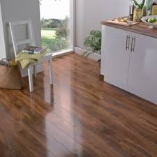 The world of laminate flooring is full of choices. Colours Dolce Caramel High Gloss Walnut Effect Laminate Flooring 5052931075560 0000005303120 Laminate Flooring Diy Flooring Walnut Laminate Flooring