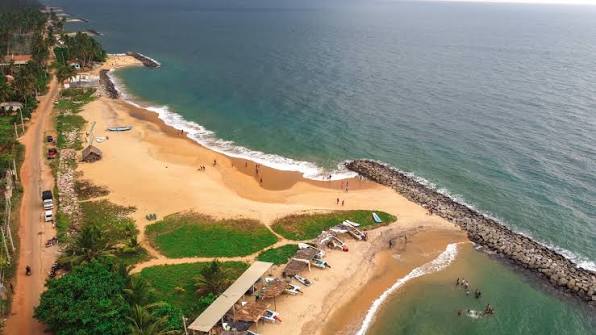 Waikkal Marawila Beach north Negombo unspoiled coconut palms coastal road local swimming Sri Lanka