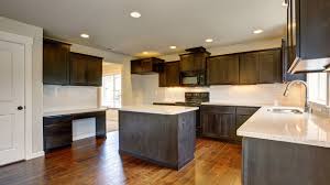 Should You Stain Or Paint Your Kitchen Cabinets For A Change In Color Stained Stained Kitchen Cabinets Kitchen Cabinet Colors Staining Cabinets