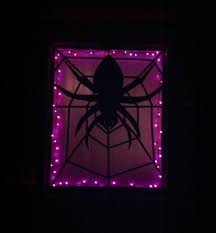 Halloween Window Silhouette Using 2 Dollar Store Plastic Tablecloths One For The Spider And O Halloween Window Silhouettes Halloween Backdrop Halloween Window