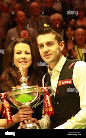 Mark Selby of England, right, poses with his wife Vikki Layton and his  champion trophy after defeating Ronnie OSullivan of England in the final of  the Stock Photo - Alamy