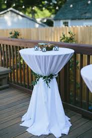 A white linen layered with a turquoise linen, a brown sash, and a sparkling brooch. Wedding Cocktail Table Decor Off 77 Buy