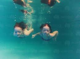 Swimming underwater with clothes on jean shorts underwater tori changing it up today! Image Of Two Girls Swimming Underwater In A Pool Austockphoto