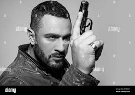 Brutal hunter man Black and White Stock Photos & Images