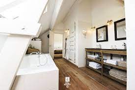 A drawer or a bathtub can be fitted in hardy accessible areas under the sloping wall. Attic Bathroom Sloped Ceiling Design Ideas