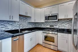 It's hard not to love the timeless appeal of white cabinets. Neutral Kitchen Backsplash Ideas With White Cabinets Novocom Top