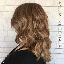 Opt for dark blonde or light brown shades through the crown to create a gentle contrast that makes the lengths stand out. 25 Honey Blonde Hair Color Ideas Trending In 2021