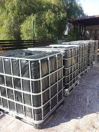 Rainwater Harvesting Ibc Totes Wrapped In 6mm Plastic The Greenman Project Rain Water Collection System Rain Water Collection Diy Rainwater Harvesting