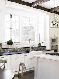 Alabaster has a light reflectance value of 82, meaning that it will reflect back a lot of light into the room. French Windows Transitional Kitchen Sherwin Williams Alabaster Brian Watford Interiors
