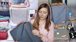 Unrecognizable woman travelling in european city after arrival. Nordace Siena Smart Backpack