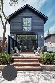 The dark house lends a distinctive air and helps set it into the landscape as a complementary structure. 12 Dark Exterior Paint Colors We Re Loving In Action Chris Loves Julia