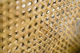 Cane chair backs are handwoven from natural cane. This Retro Furniture Trend Is Ideal For Homes Down South The Comeback Of Caned Furniture