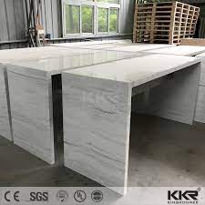 The long, oval top is made of sturdy acacia. China Artificial Marble Solid Surface Custom Made Long Narrow Marble Bar Table China Home Furniture Dining Table