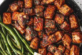 It's a bbq fit for a sunday meal with this whole boneless pork loin barbeque recipe! Garlic Butter Pork Bites Recipe With Lemon Green Beans Pork Cubes Recipe Eatwell101