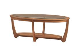Midcentury oval coffee tables fashioned from wood strike a nice balance, as they'll add warmth to the room without feeling. Shades 5834 Glass Top Oval Coffee Table Dining Coffee Tables