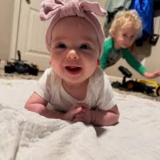 Look who is 4 months old!!! Little sis, sweet peach, Miss P is so smiley  and happy! Her brothers adore her. They love giving her kisses and singing  to her! Can't believe