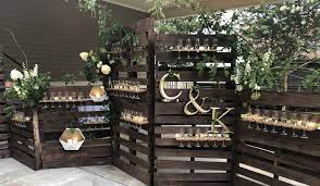 Champagne Wall To Greet Your Wedding Guests Pallet Wedding Decor Outdoor Wedding Bar Modern Wedding Diy