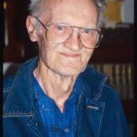 Professor E.O. Wilson talks to young people with and insect