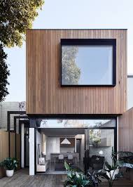 This living area has a spectacular stone fireplace. Loft House Tom Robertson Architects Archdaily