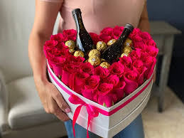 Composite image of red heart. Gift Heart Shaped Box With Roses Chocolate And Champagne