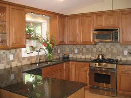 light maple kitchen cabis with granite