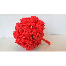 Wedding bouquet is an important part of the bridal look. Wedding Bouquet In Red Roses With Diamante Pins