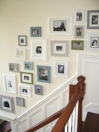 I started by sanding, priming and then painting the oak part of our railing white. 16 Staircase Picture Collage Ideas Staircase Pictures Home Diy Home Decor