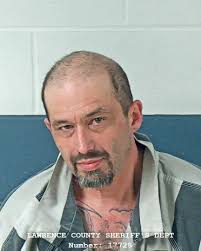 Man arrested after allegedly dragging woman out of a house by her legs