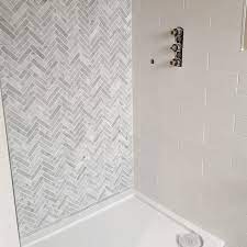 A bold bathroom with a chevron floor. Carrara Marble Honed Chevron Mosaic 30x31 7cm Tile Luxury Tiles