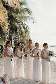 Bridesmaids In This Beach Wedding Wore Soft Cream Colored Dresses That Perfectly Matched The White San White Bridesmaid Dresses Mexico Wedding Artistic Wedding