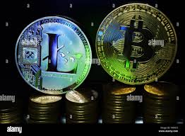 Physical Litecoin LTC and Bitcoin BTC on a dark background and gold coins.  Concept of cryptocurrency Stock Photo - Alamy
