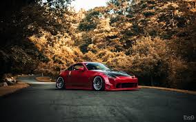 Jdm hd wallpapers, desktop and phone wallpapers. Red Volkswagen 5 Door Hatchback Car Nissan 350z Jdm Road Hd Wallpaper Wallpaper Flare