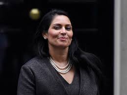 The british home secretary is the first woman of color to hold the role. Priti Patel S Resting Smirk Face Makes Her Westminster S Perfect Pantomime Villain British Vogue