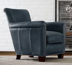 They have got a nailhead trim, spanish style, espresso finish and solid. Irving Roll Arm Leather Armchair With Nailheads Pottery Barn
