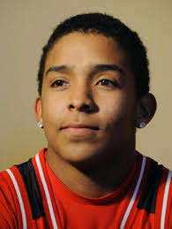 Boy saves woman in icy pond