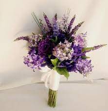 Royal blue bridesmaid dresses, purple bouquets with royal blur ribbon, white wedding ceremony arch decorate with purple flower, royal. Winter Wedding Purple Bouquet 1 I Take You Wedding Readings Wedding Ideas Wedding Dresses Wedding Theme