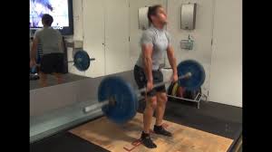 Bending knees slightly, pull bar up toward shoulders, extending legs as you push off balls of feet, bringing elbows out to sides. Barbell Power Clean Exercise Demo Youtube