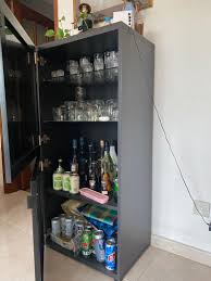 Rubbing alcohol, also called isopropyl alcohol, poses a hazard to most wood furniture finishes. Ikea Liquor Cabinet With Glass Door Furniture Home Living Furniture Shelves Cabinets Racks On Carousell