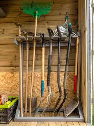 Storing gardening tools such as fowls, chainsaws, and shovels need a little organization. Don T Let An Avalanche Of Shovels And Rakes Happen To You These Genius Garden Tools Storage Rack Soluti Garden Tool Rack Garden Tool Organization Garden Tools